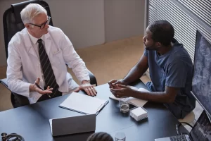 Resident In Harvey Meeting With Medical Professional Image